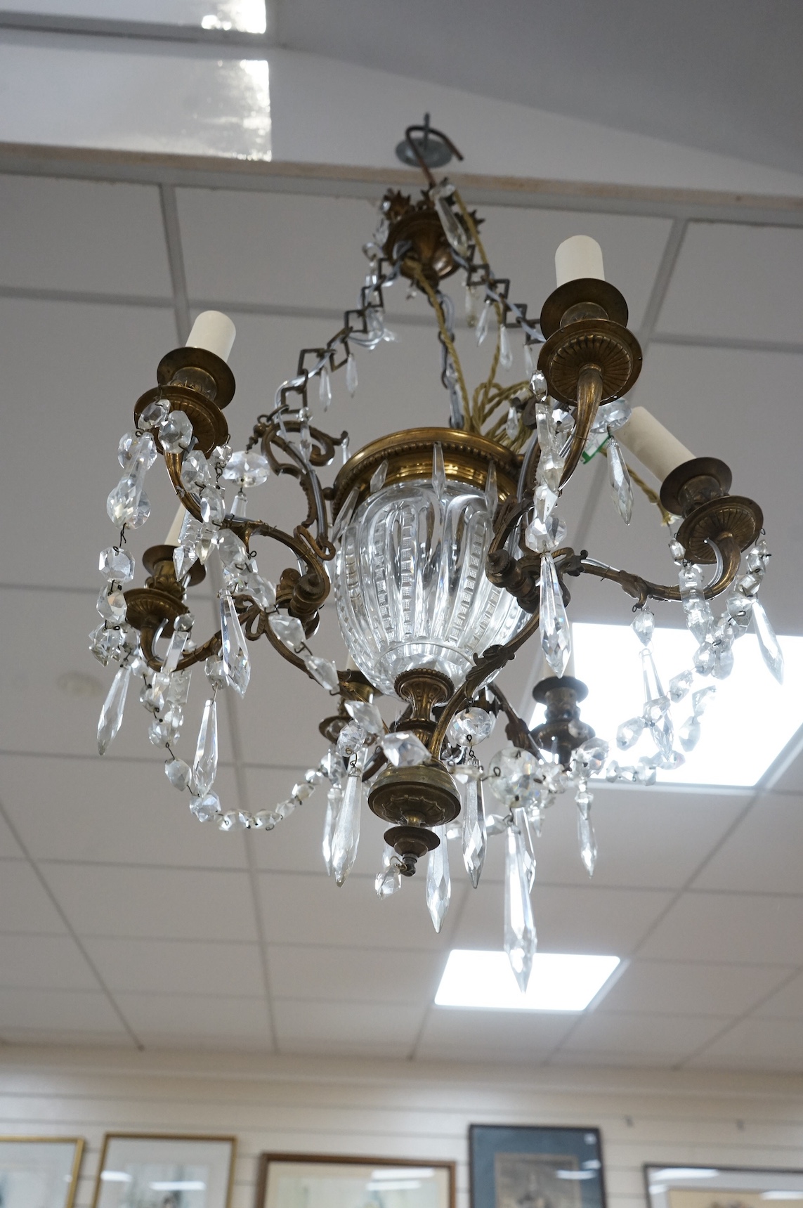 A glass and brass six branch chandelier, 65cm high. Condition - fair
